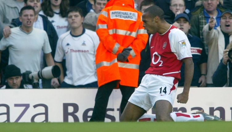 Arsenal's Thierry Henry celebrates in front of the Tottenham fans.