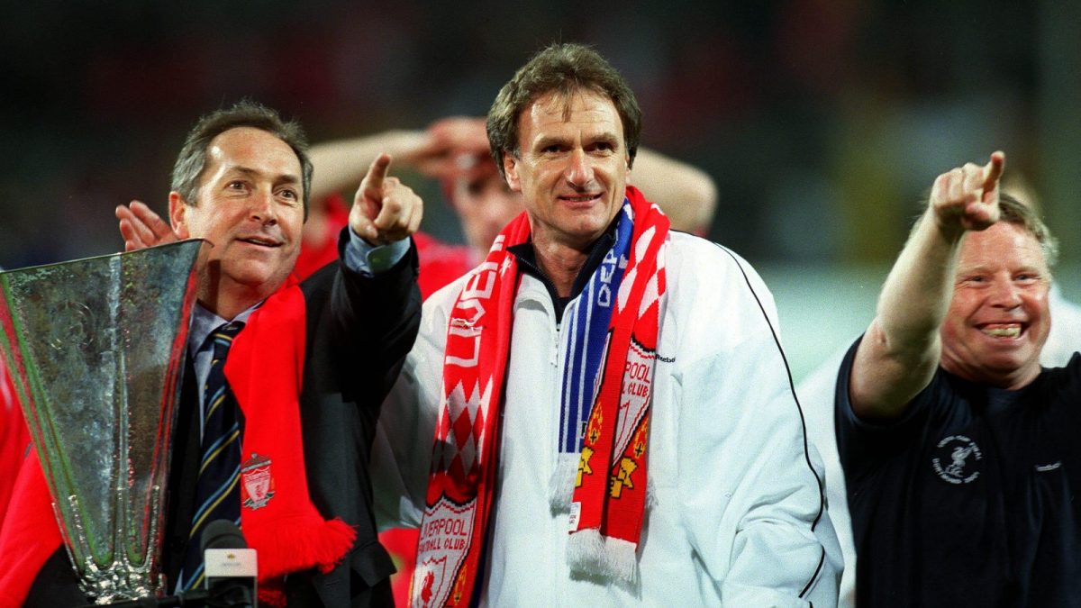 Reds boss Gerard Houllier holding the UEFA Cup alongside Phil Thompson and Sammy Lee.