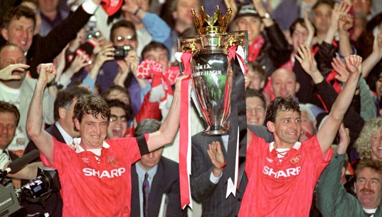 Manchester United's Steve Bruce and Bryan Robson lift the Premier League title.