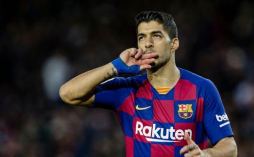 Uruguay international Luis Suarez celebrates scoring for FC Barcelona