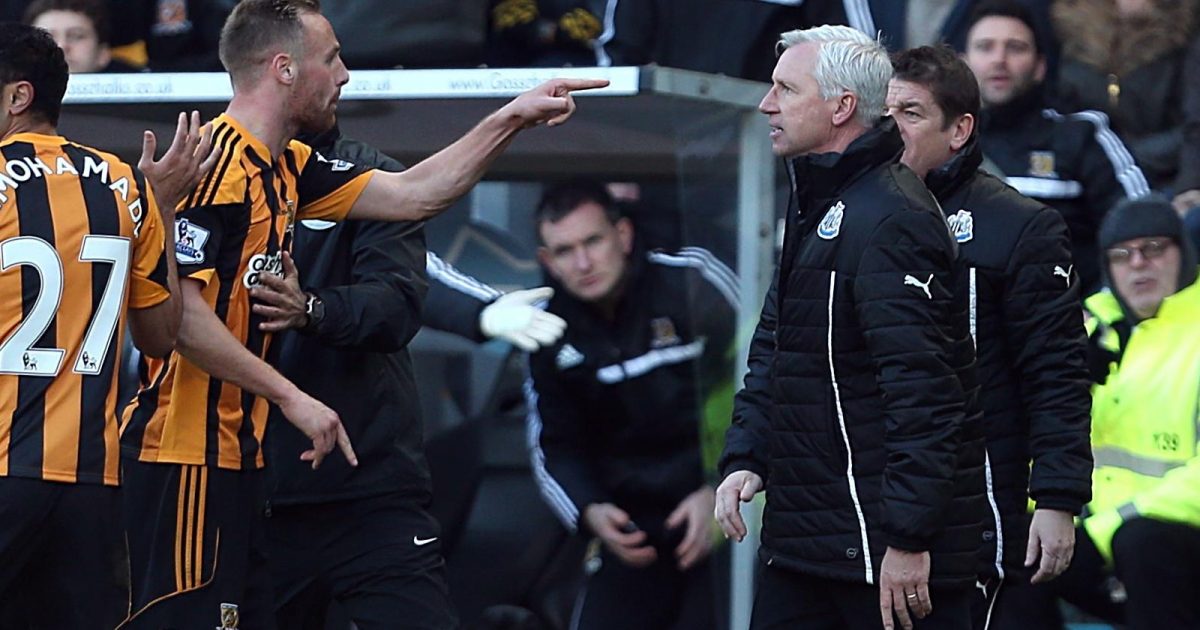 Newcastle United's manager Alan Pardew and Hull City's David Meyler confront each other