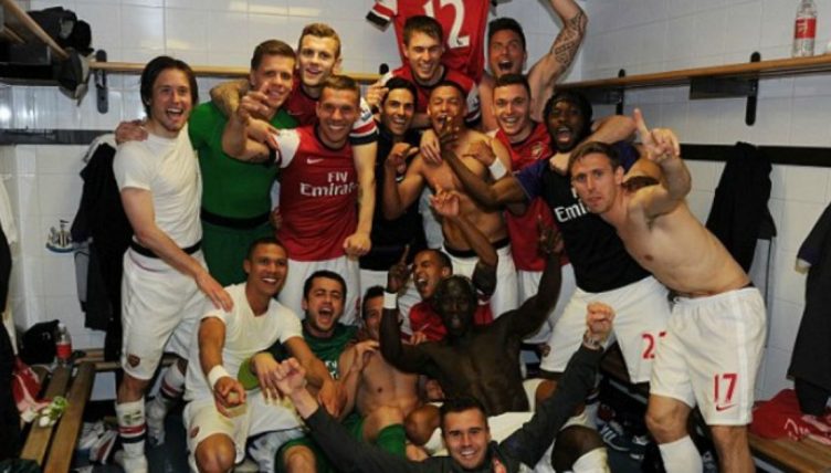 Arsenal players celebrate getting into the Premier League top four. St James' Park, May 2013.