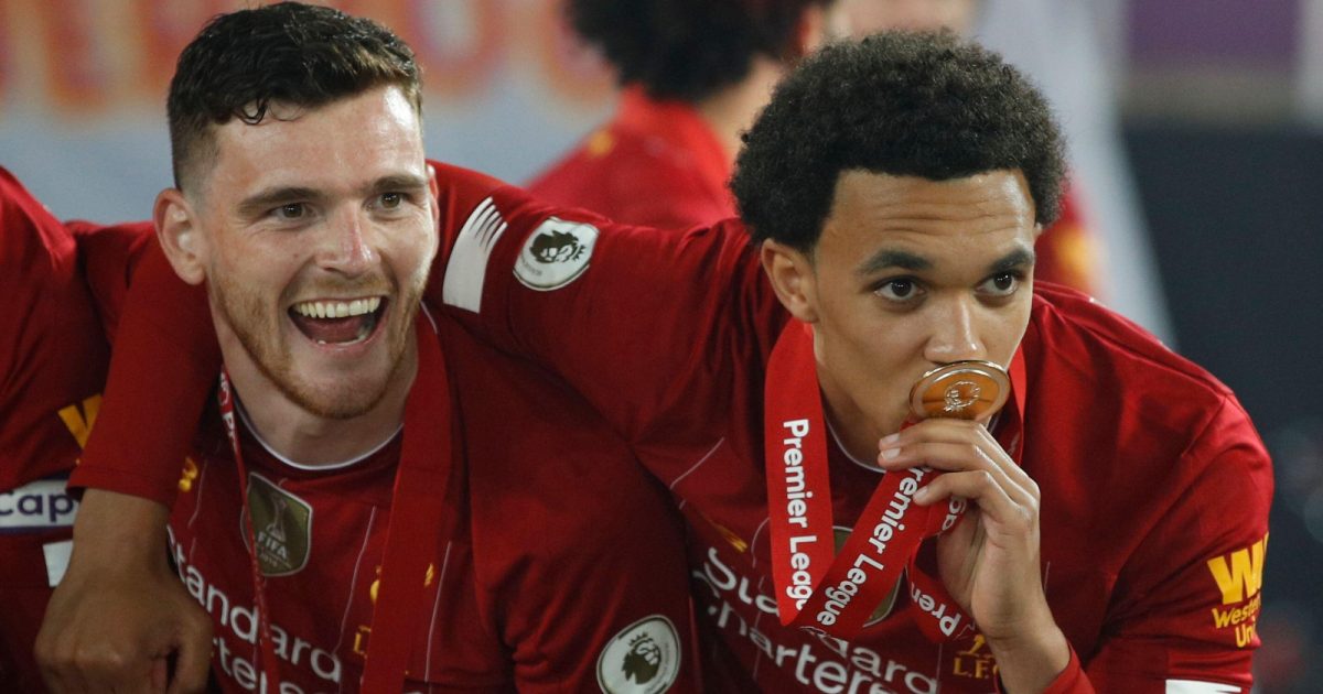 Liverpool's Trent Alexander-Arnold, right with Liverpool's Andrew Robertson, pose for the cameras following the presentation of the English Premier League trophy, Anfield, Liverpool, July 2020.