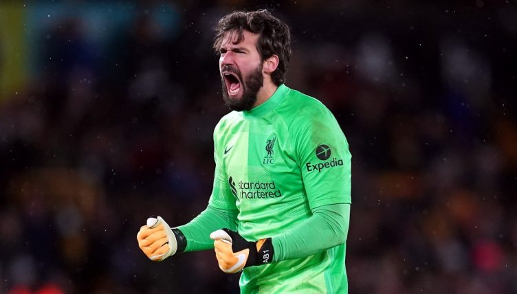 Liverpool goalkeeper Alisson celebrating a goal at Molineux, Wolverhampton, December 4 2021.