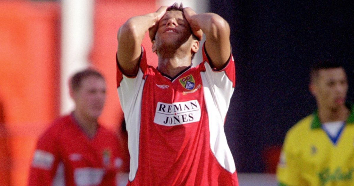 Morecambe's Julian Dowe holds his head in despair after missing a great chance