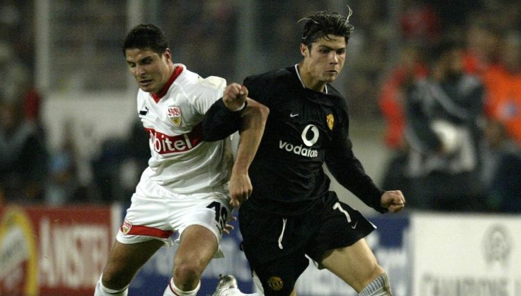 Manchester United's Cristiano Ronaldo battles past the challenge from Stuttgart's Imre Szabics.