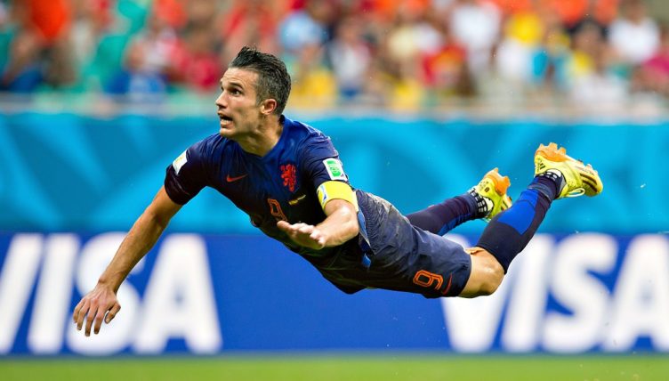 Robin van Persie scores a flying header for the Netherlands v Spain at World Cup 2014.