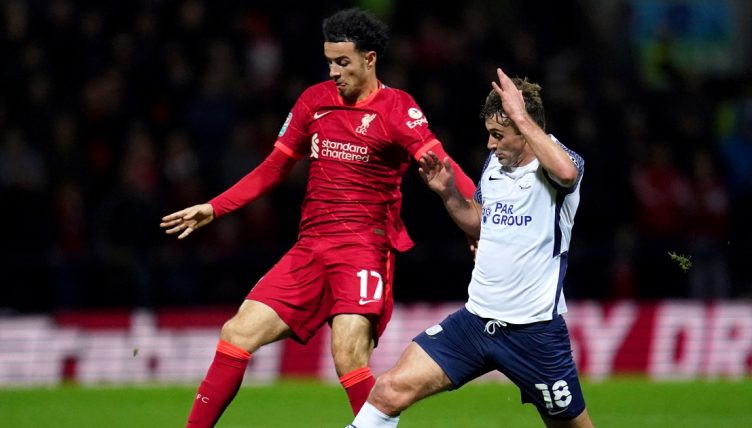 Liverpool's Curtis Jones battles for the ball with Preston North End's Ryan Ledson.