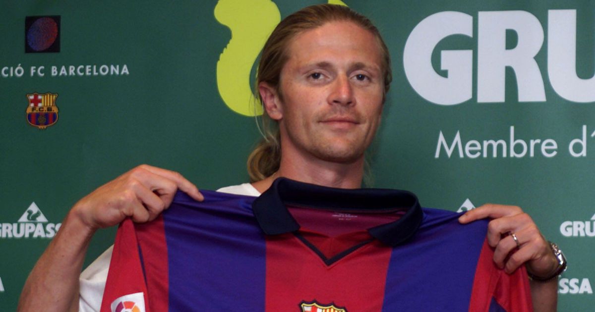 French International Emmanuel Petit displays Barcelona team shirt at FC Barcelona's Nou Camp Stadium, Barcelona, Catalonia. July 30, 2000.