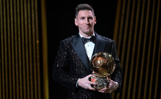 PSG's Lionel Messi poses with the 2021 Ballon d'Or award.