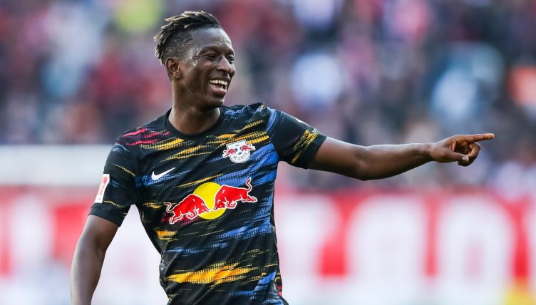 Amadou Haidara laughing while playing for RB Leipzig.