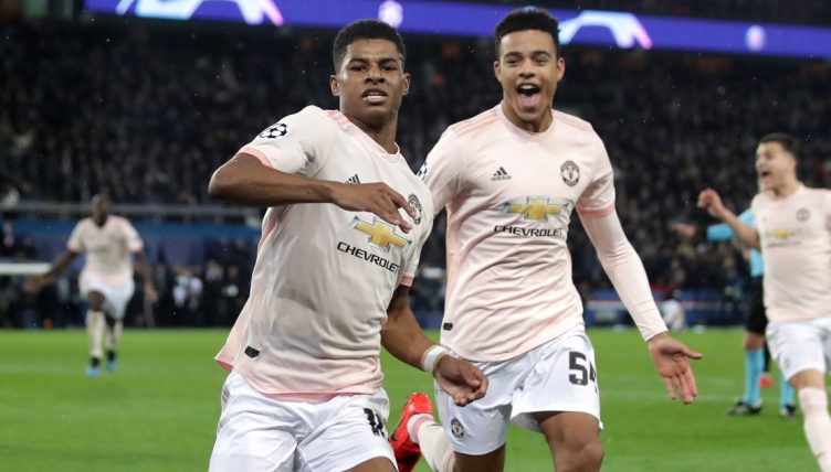 Marcus Rashford celebrates with Mason Greenwood after scoring for Manchester United against PSG.