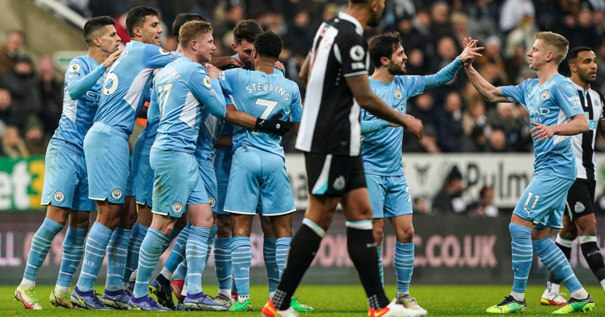 Manchester City's Riyad Mahrez (hidden) celebrates scoring their side's third goal of the game after VAR overturn the decision to initially rule out the goal during the Premier League match at St. James' Park, Newcastle. Picture date: Sunday December 19, 2021.
