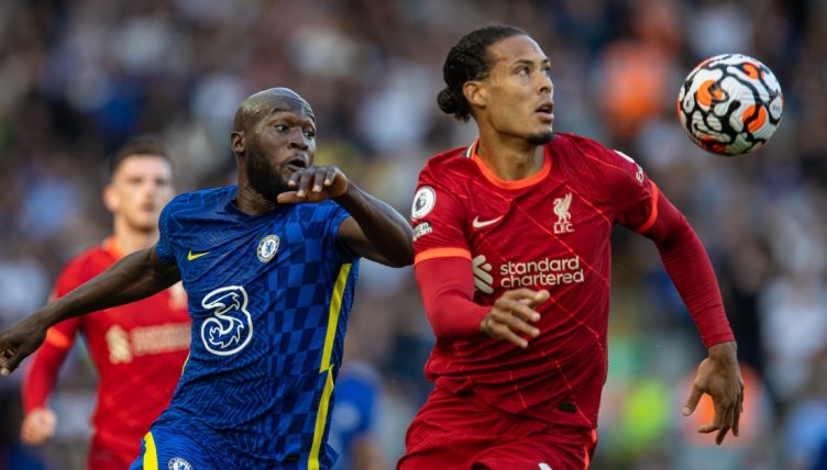 Liverpool's Virgil Van Dijk and Chelsea's Romelu Lukaku tussle for the ball, Anfield, August 2021.