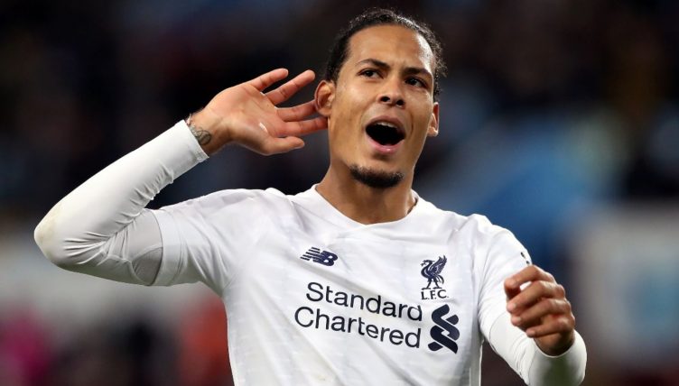 Liverpool's Virgil van Dijk celebrates with fans after the win against Aston Villa at the end of the Premier League match at Villa Park, Birmingham. Issue date: Friday August 13, 2021.