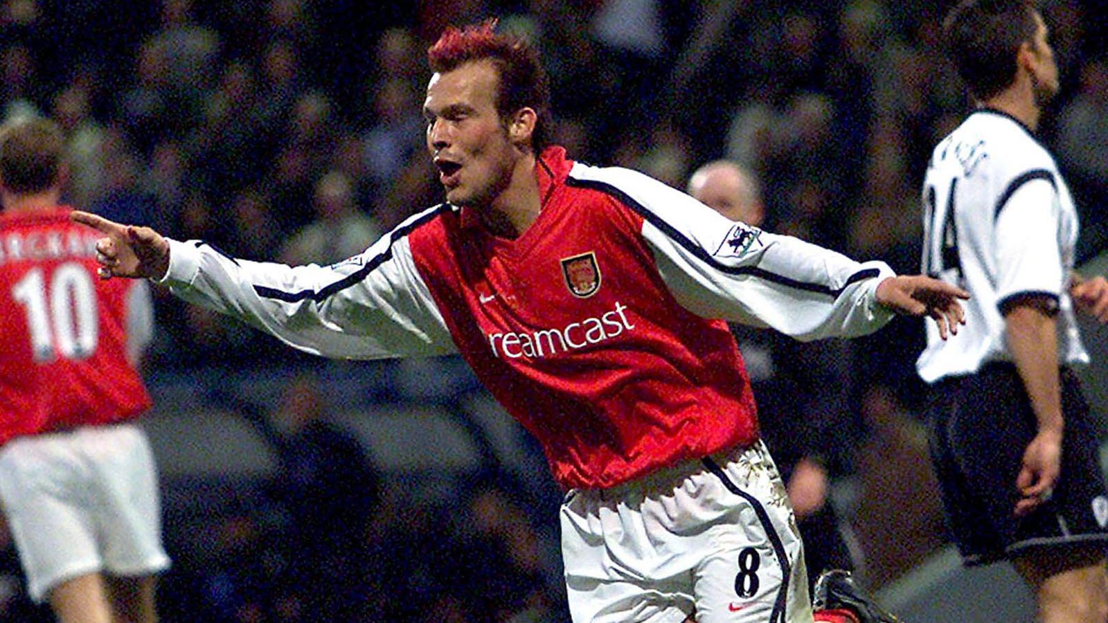 Arsenal's Fredrik Ljungberg of Sweden celebrates his goal against Bolton Wanderers during their English Premier League match at the Reebok Stadium, in Bolton