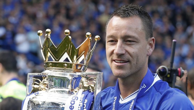 Chelsea captain John Terry lifts the Premier League trophy after the victory over Sunderland, May 2017.