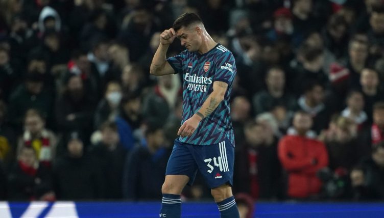 Arsenal's Granit Xhaka leaves the pitch after being shown a red card. Anfield, January 2022.