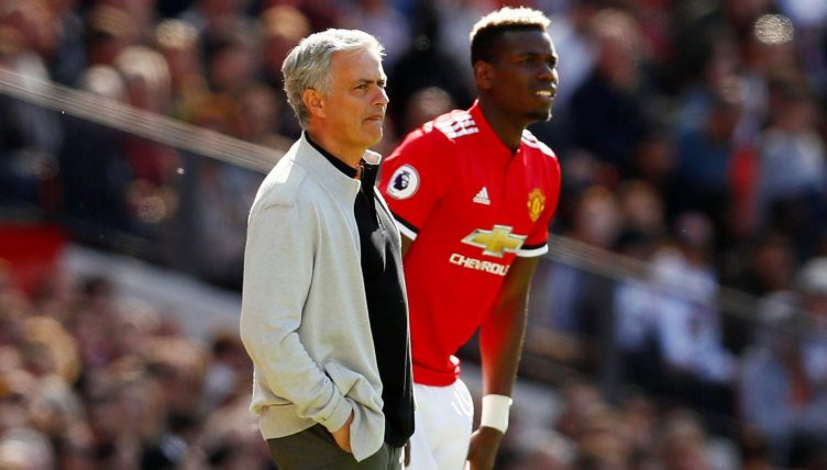 Manchester United manager Jose Mourinho with substitute Paul Pogba during their Premier League match against Watford at Old Trafford, Manchester, May 2018.