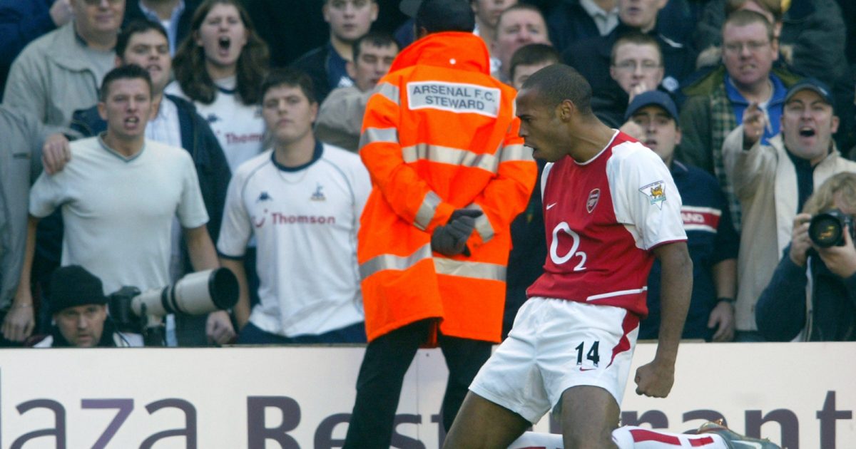 Arsenal's Thierry Henry celebrates in front of the Tottenham fans.
