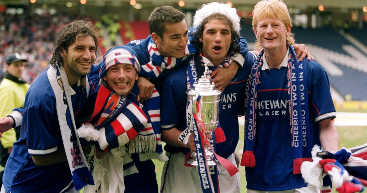 Gabriel Amato, Derek McInnes, Giovanni Van Bronckhorst, Lorenzo Amoruso and Colin Hendry celebrate after the Scottish Cup final between Celtic and Rangers at Hampden Park, Glasgow, May 1999.