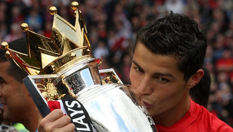 Manchester United's Cristiano Ronaldo kisses the Premier League trophy. Old Trafford, May 2009.