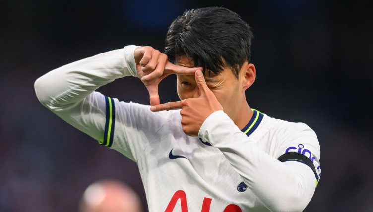 Tottenham Hotspur's Heung-Min Son celebrates with the matchball after scoring a hat-trick during the Premier League match against Leicester City. Tottenham Hotspur Stadium, London. 17 September 2022.