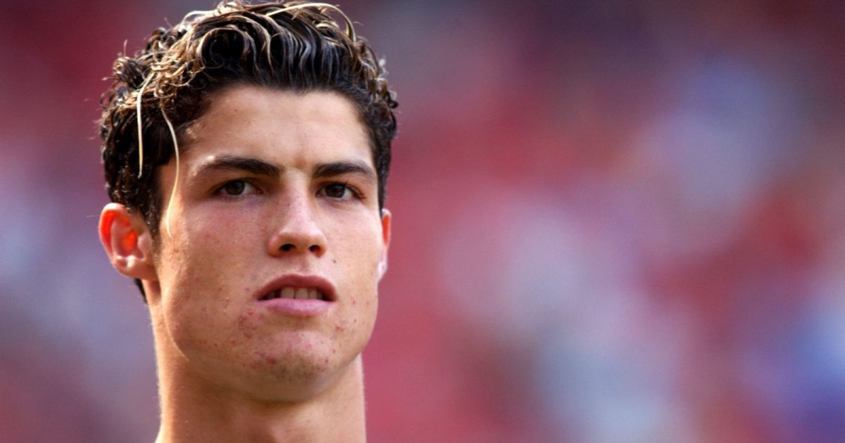 Cristiano Ronaldo watches play during his Manchester United debut against Bolton Wanderers in the Premier League. Old Trafford, Manchester, 16 August 2003.