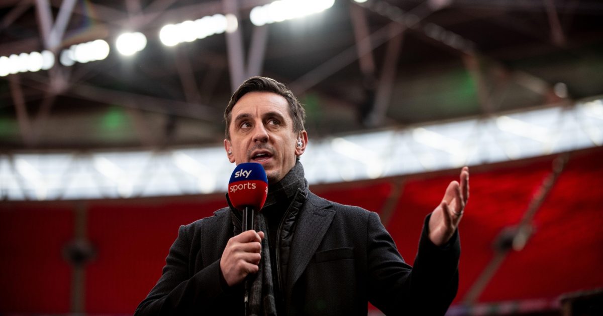 Gary Neville commentating for Sky Sports during a match at Wembley Stadium.