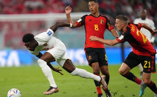 Canada's Alphonso Davies (left) and Belgium's Timothy Castagne (right) and Youri Tielemans battle for the ball during the FIFA World Cup Group F match at the Ahmad bin Ali Stadium, Al Rayyan. Picture date: Wednesday November 23, 2022.