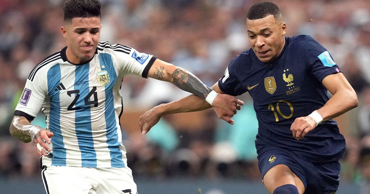 Argentina's Enzo Fernandez (left) and France's Kylian Mbappe battle for the ball during the FIFA World Cup final at Lusail Stadium