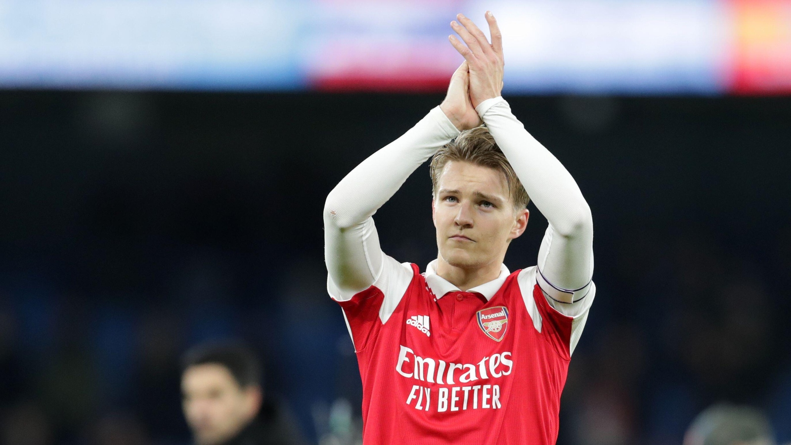 Martin Odegaard applauds the away fans after the FA Cup match between Manchester City and Arsenal at Etihad Stadium, Manchester, January 2023.