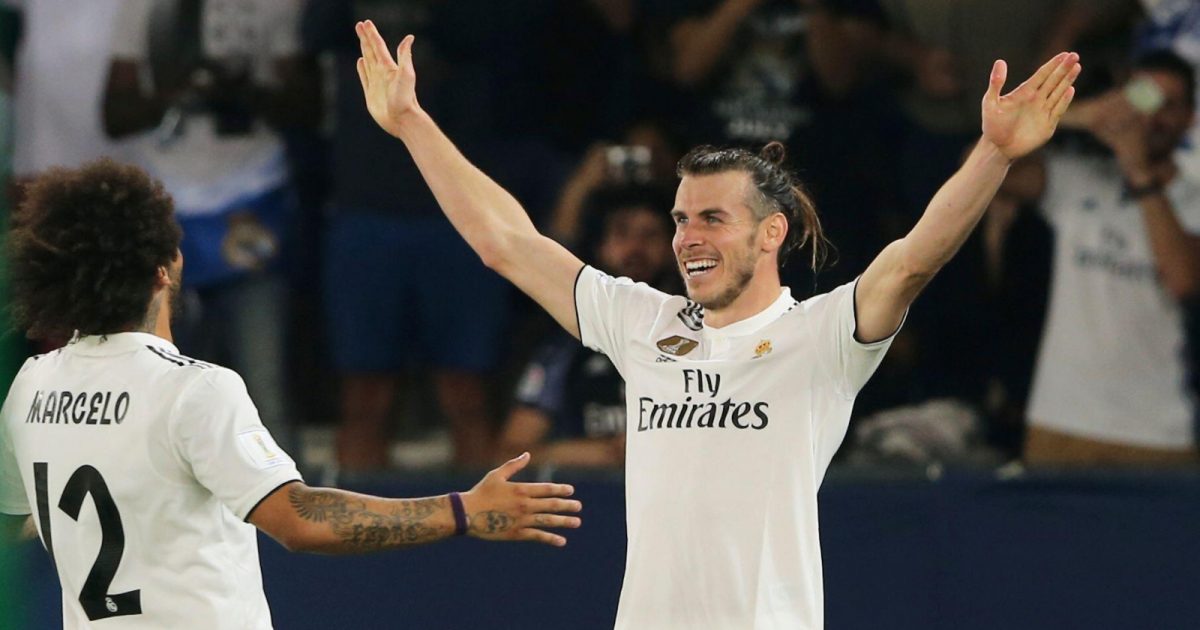 Real Madrid's midfielder Gareth Bale celebrates with teammate Marcelo, left, after scoring his side's third goal during the Club World Cup semifinal soccer match between Real Madrid and Kashima Antlers at Zayed Sports City stadium in Abu Dhabi, United Arab Emirates, Wednesday, Dec. 19, 2018.