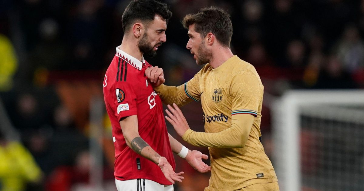 Bruno Fernandes of Manchester United and Sergi Roberto of Barcelona clash during the UEFA Europa League match at Old Trafford, Manchester, February 2023.