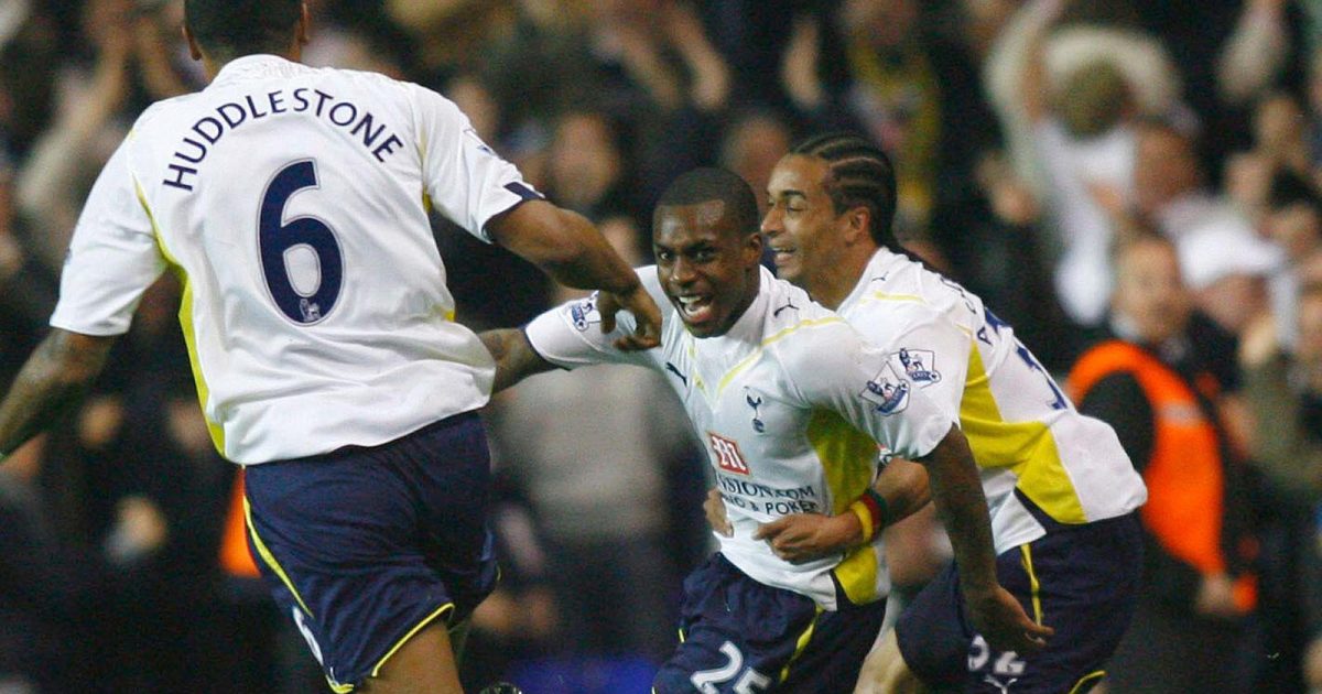 Danny Rose of Tottenham Hotspur, center, celebrates with teammates Tom Huddlestone, left, and Benoit Assou-Ekotto, right, after scoring the team's first goal against Arsenal during an English Premier League soccer match at White Hart Lane, London Wednesday April 14, 2010