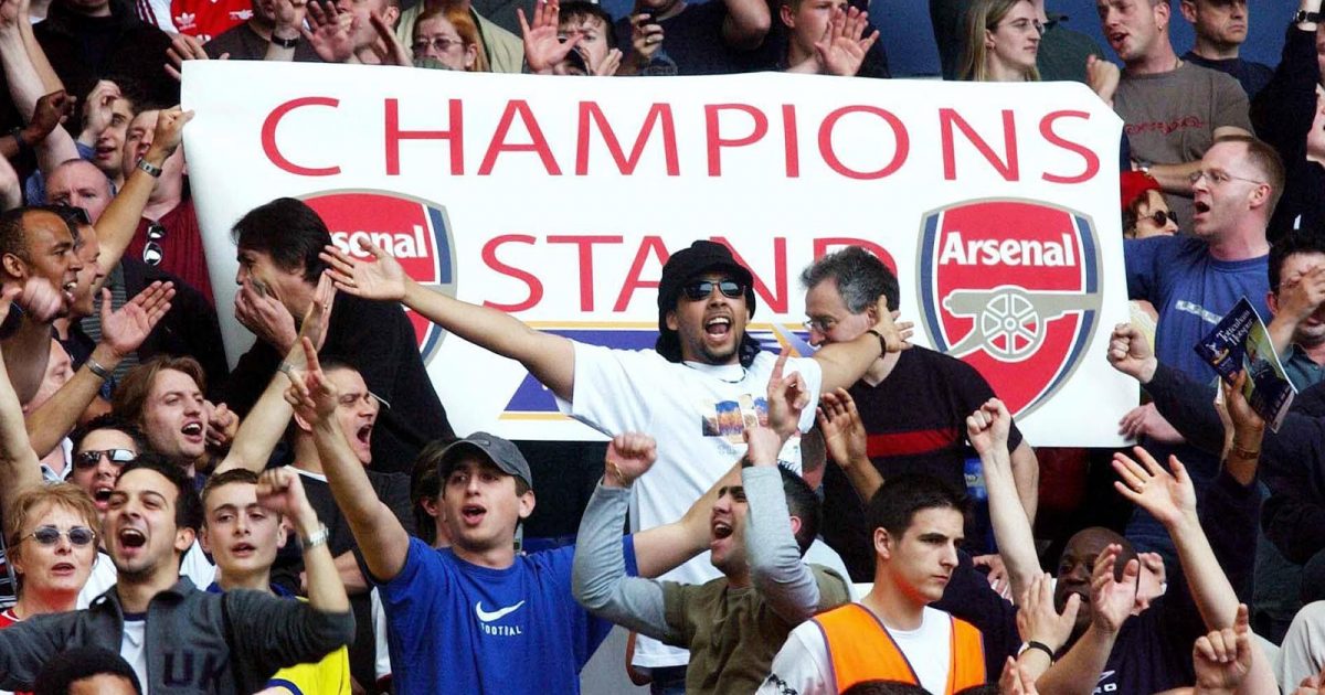 Arsenal fans celebrate in the stands after their Barclaycard Premiership game against Tottenham Hotspur at White Hart Lane, London.