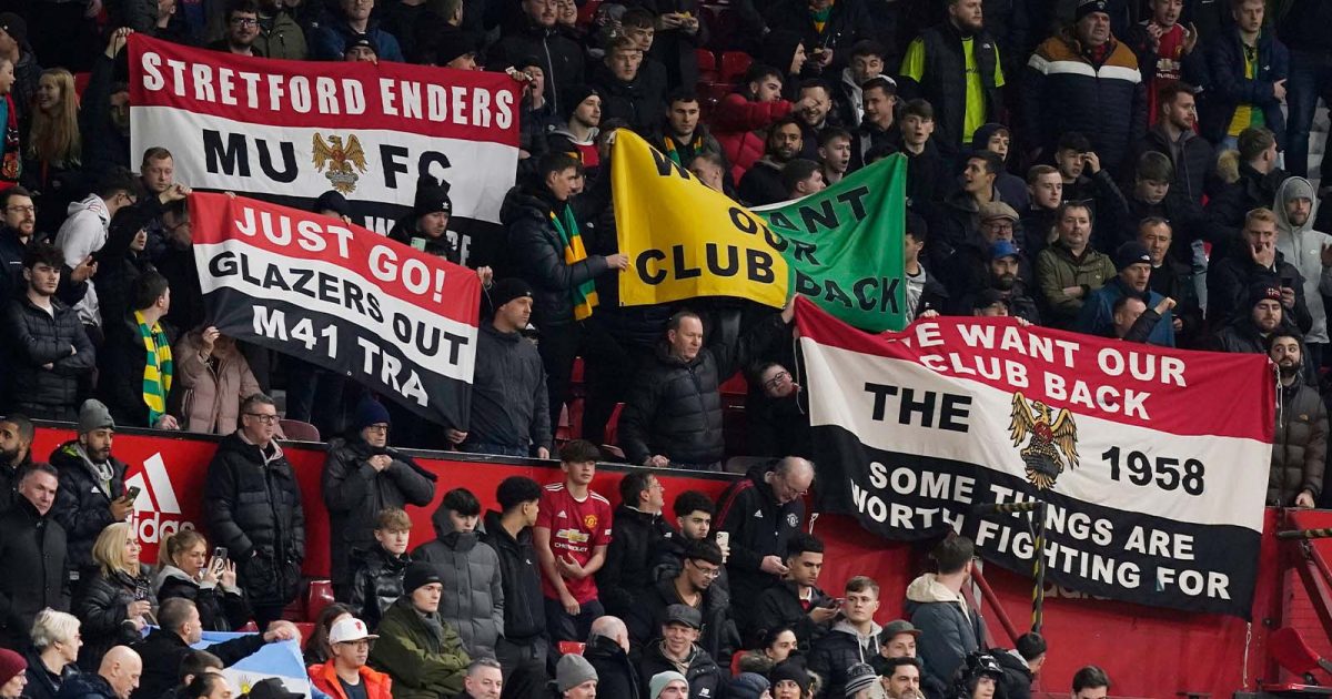 Manchester, England, 10th January 2023. Manchester Utd fans with banners against the owners of the club during the Carabao Cup match at Old Trafford
