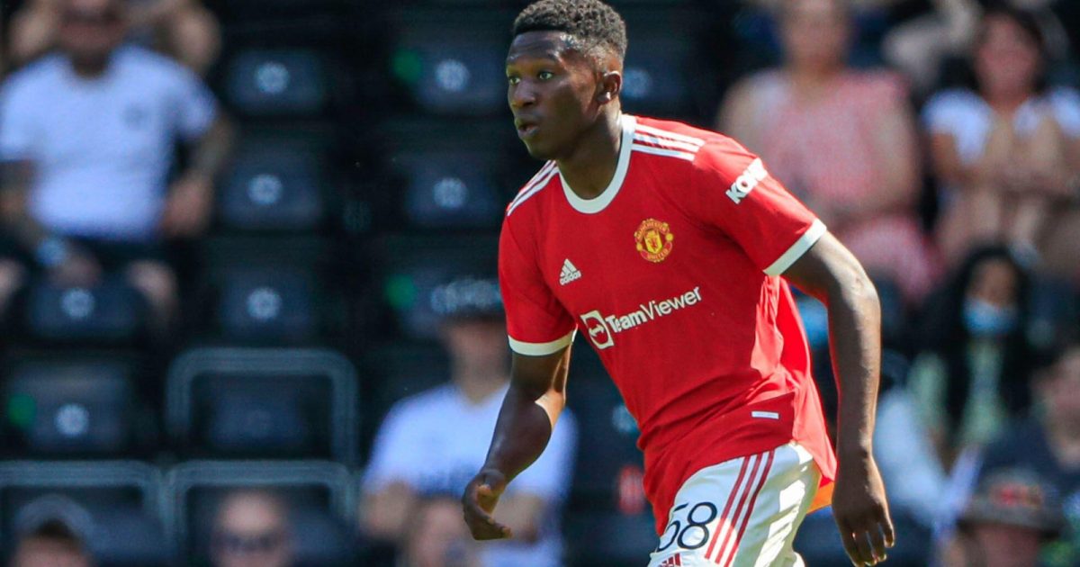 DiShon Bernard #58 of Manchester United runs with the ball