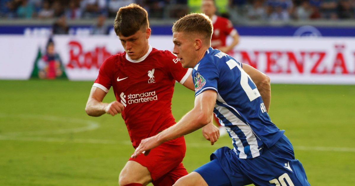 Karlsruhe, Germany. 19th July, 2023. Soccer: Test matches, Karlsruher SC - FC Liverpool: Liverpool's Ben Doak (M) and Karlsruhe's David Herold fight for the ball.