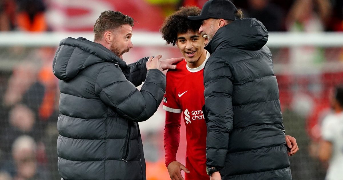 Luton Town manager Rob Edwards (left) and Liverpool manager Jurgen Klopp speak to Jayden Danns at the end of the Premier League match at Anfield, Liverpool.