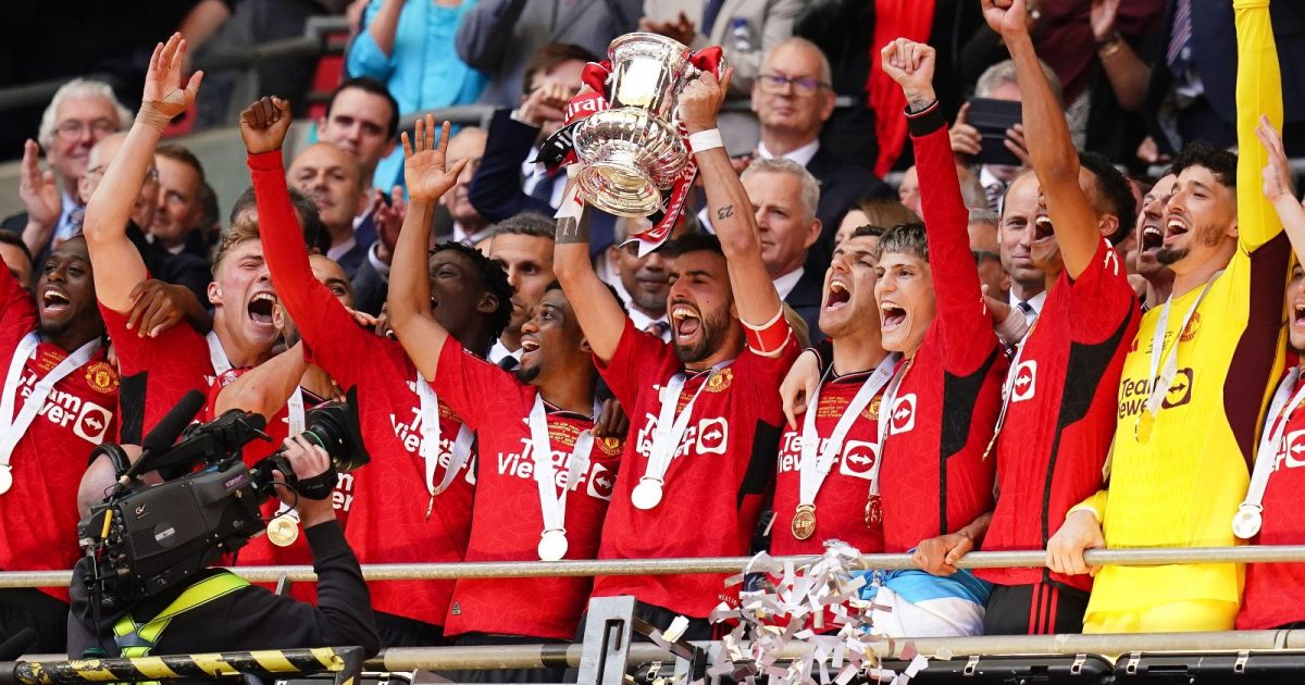 Manchester United's Bruno Fernandes lifts the FA Cup Trophy after winning the Emirates FA Cup final at Wembley Stadium, London. Picture date: Saturday May 25, 2024.