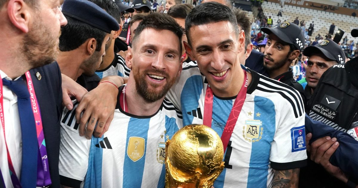 Argentina's Lionel Messi (left) and Angel Di Maria celebrate with the FIFA World Cup Trophy following victory over France via a penalty shootout in the FIFA World Cup Final match at the Lusail Stadium in Lusail, Qatar. Picture date: Sunday December 18, 2022.