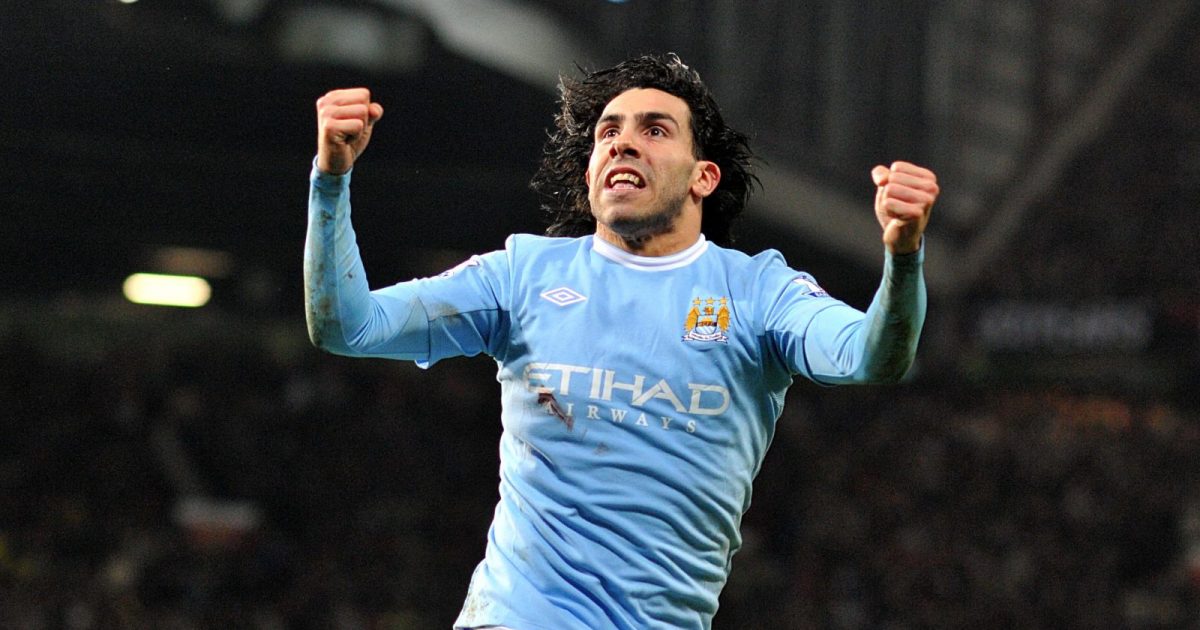Carlos Tevez celebrates for Manchester City at Old Trafford.
