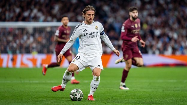 Madrid, Madrid, Spain. 19th Feb, 2025. Luka Modric of Real Madrid CF in action with the ball during the UEFA Champions League 2024/25 League Knockout Play-off second leg match between Real Madrid C.F. and Manchester City at Estadio Santiago Bernabeu on February 19, 2025 in Madrid, Spain.