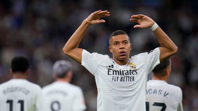 Real Madrid's Kylian Mbappe celebrates after scoring his side's second goal during a Spanish La Liga soccer match between Real Madrid and Alaves at Santiago Bernabeu stadium in Madrid, Spain, Tuesday, Sept. 24, 2024.