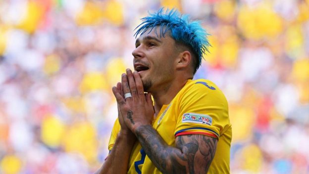 Munich, Germany. 17th June, 2024. Soccer, UEFA Euro 2024, European Championship, Romania - Ukraine, Preliminary round, Group E, Matchday 1, Munich Football Arena, Romania's Andrei Ratiu reacts