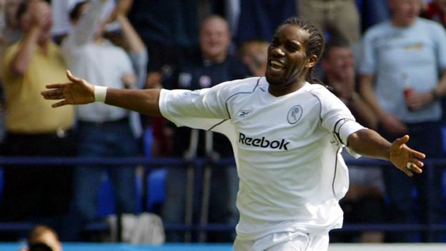 Bolton's Jay Jay Okocha celebrates his opening goal against Charlton during their Barclays Premiership match at the Reebok Stadium, Bolton, Saturday August 14, 2004.