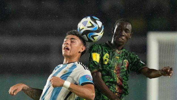Argentina's Agustin Ruberto, left, battles for the control of the ball against Mali's Sekou Kone during their U-17 World Cup third place playoff soccer match
