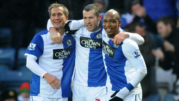 Blackburn Rovers' Brett Emerton (centre) celebrates scoring his side's second goal with Morten Gamst Pedersen (left) and El-Hadji Diouf