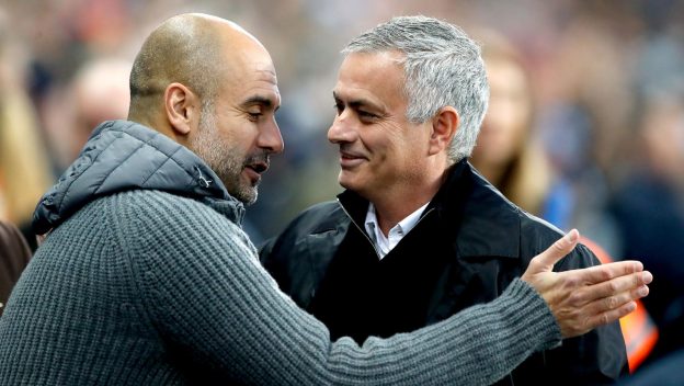 Manchester City manager Pep Guardiola (left) and Manchester United manager Jose Mourinho before kick-offduring the Premier League match at the Etihad Stadium, Manchester.